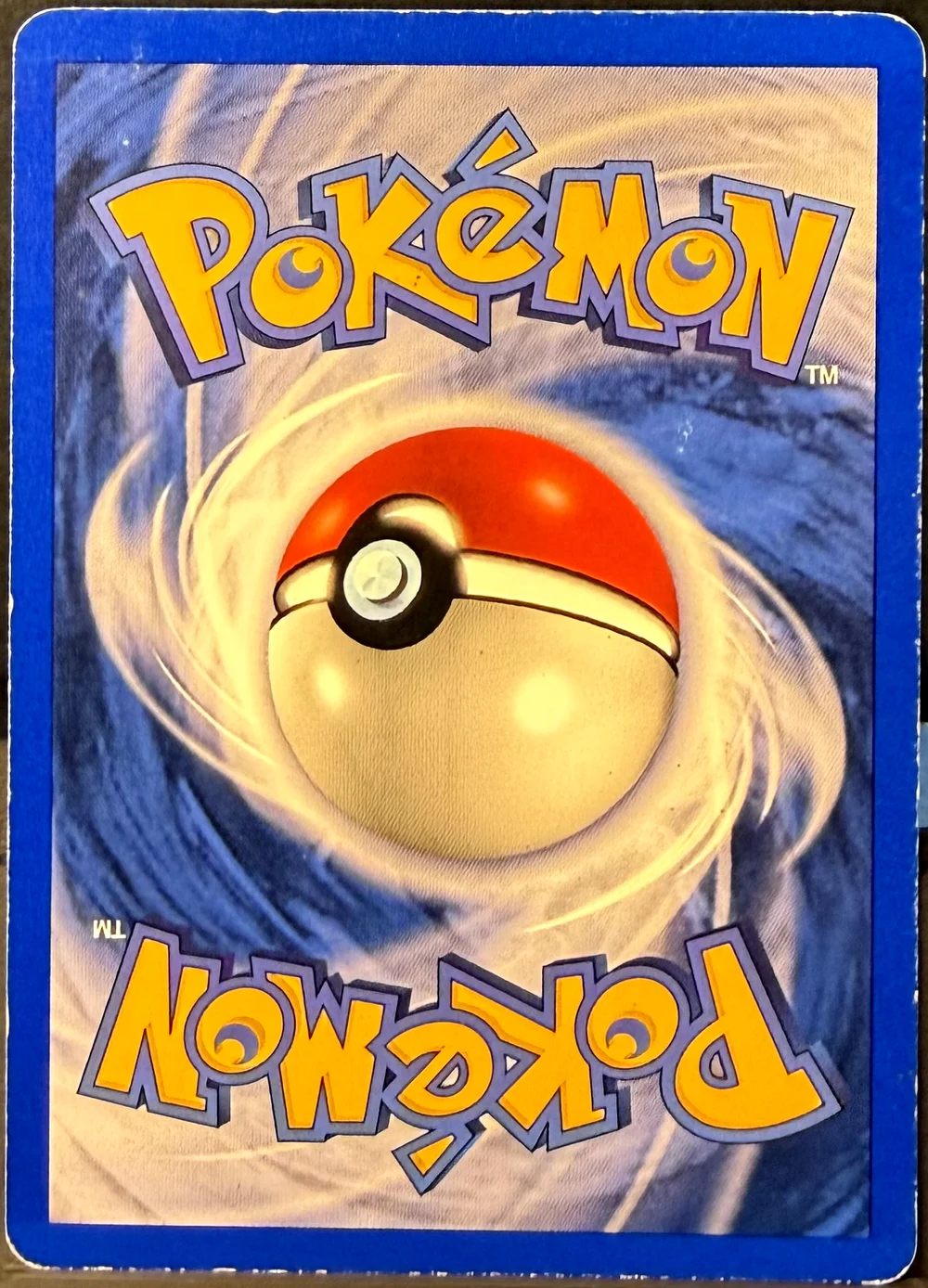 Back of a Pokémon card in Heavily Played condition.