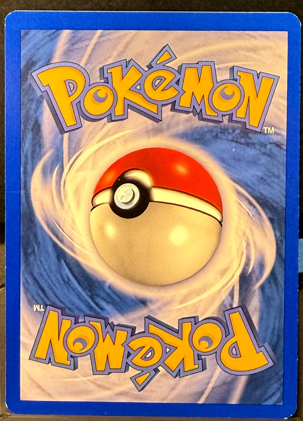 Back of a Pokémon card in Lightly Played condition.