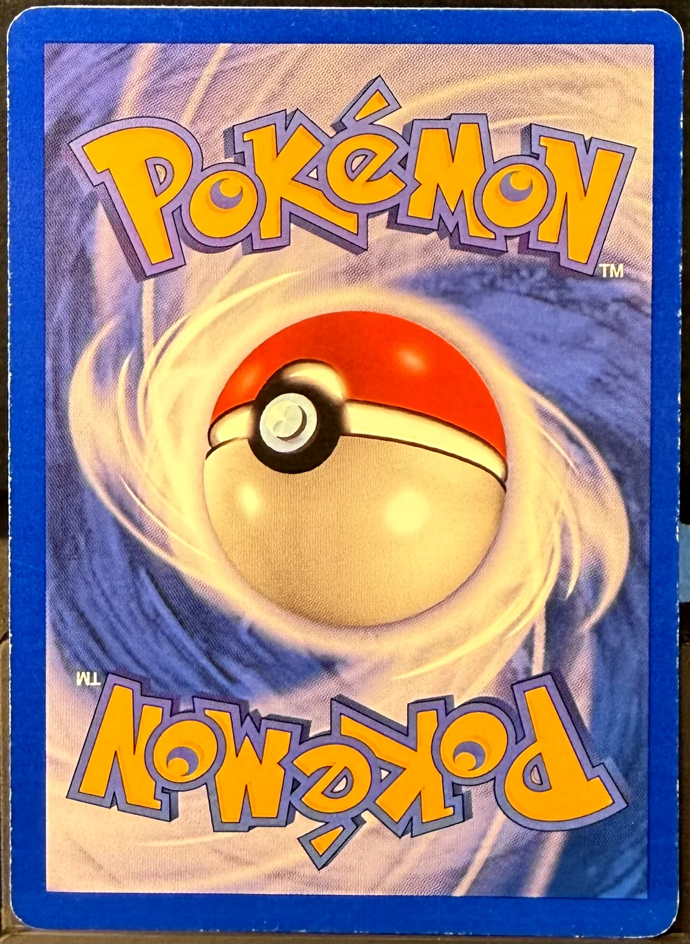Back of a Pokémon card in Moderately Played condition.