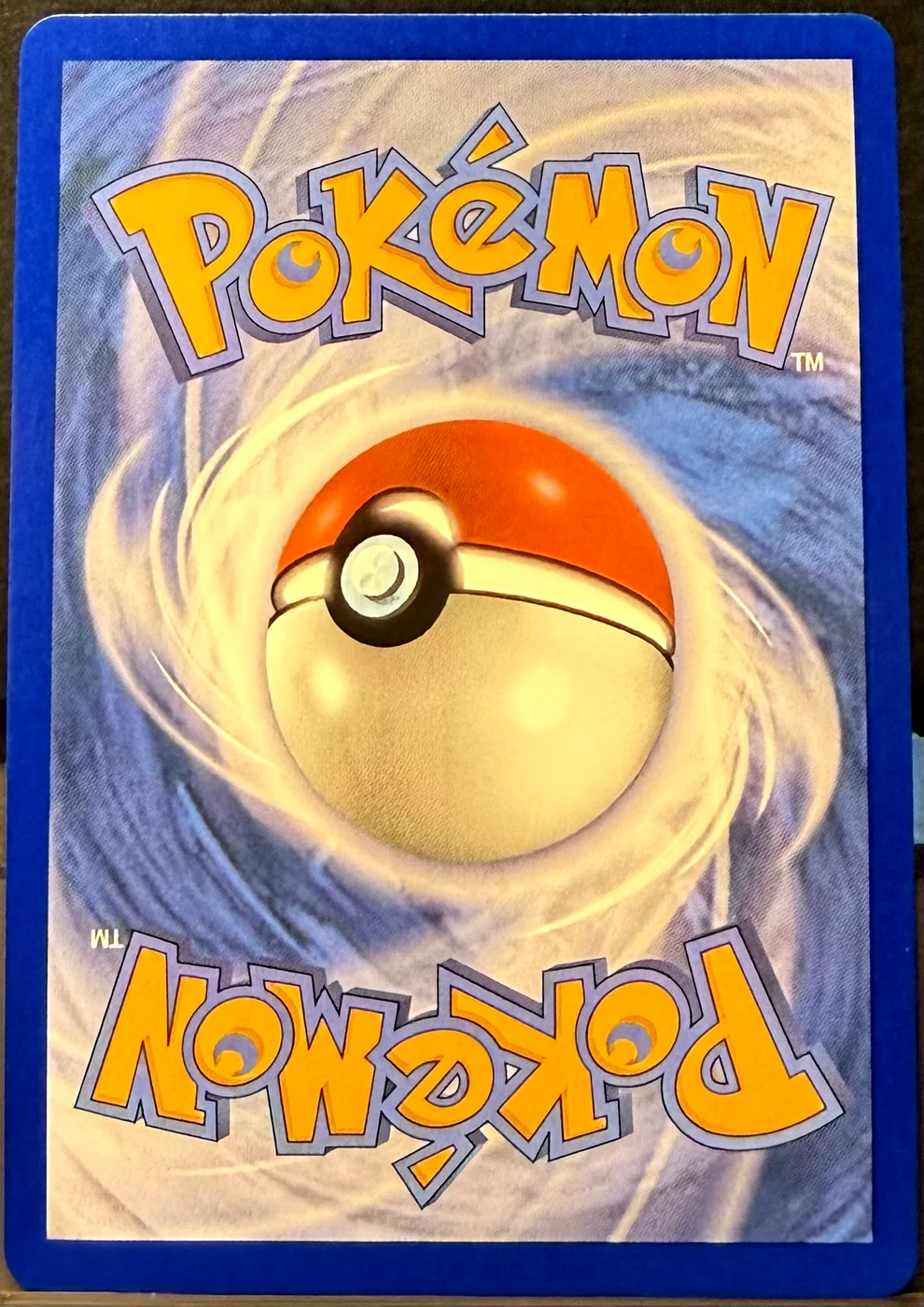 Back of a Pokémon card in Near Mint condition.