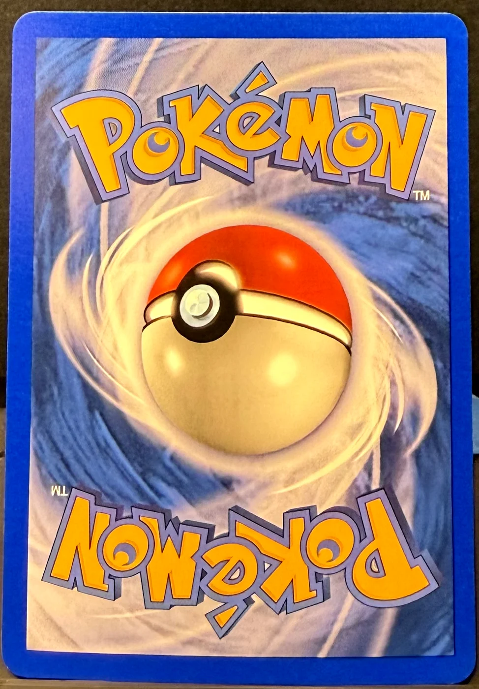 Back of a Pokémon card in Near Mint condition.