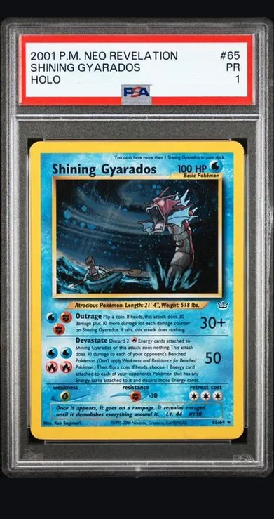 A PSA 1 graded 2001 Neo Revelation Shining Gyarados whose label reads only
                HOLO, with no error line.